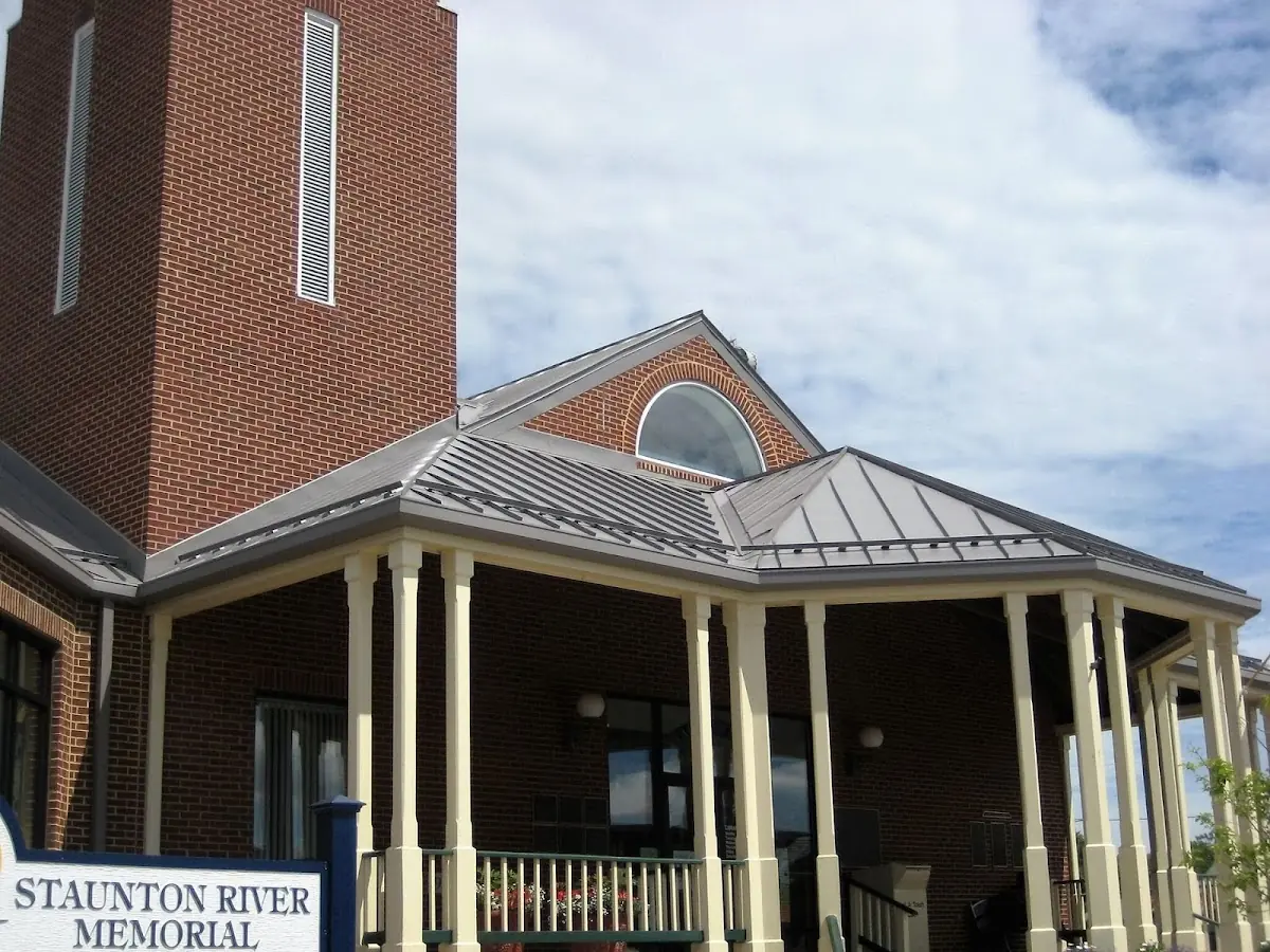 Skilled roofing craftsmen working on a residential roof in Osprey